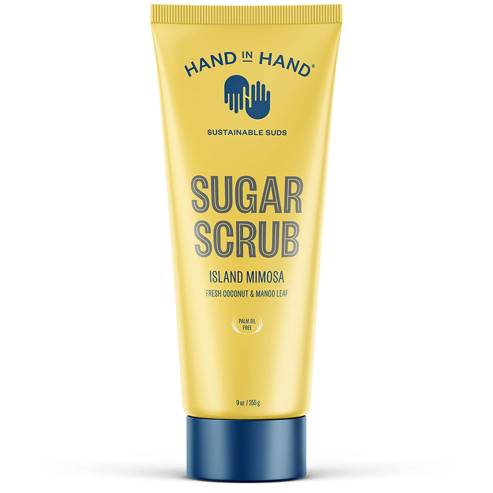 Hand in Hand Sugar Scrub bottle closeup, tropical Island Mimosa scent enhances shower routine and smooths skin.