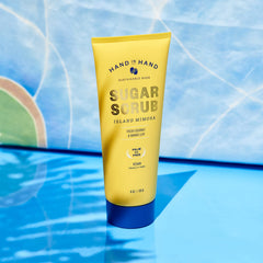 Hand in Hand Sugar Scrub coconut oil closeup highlights quick absorbing, hydrating moisture.