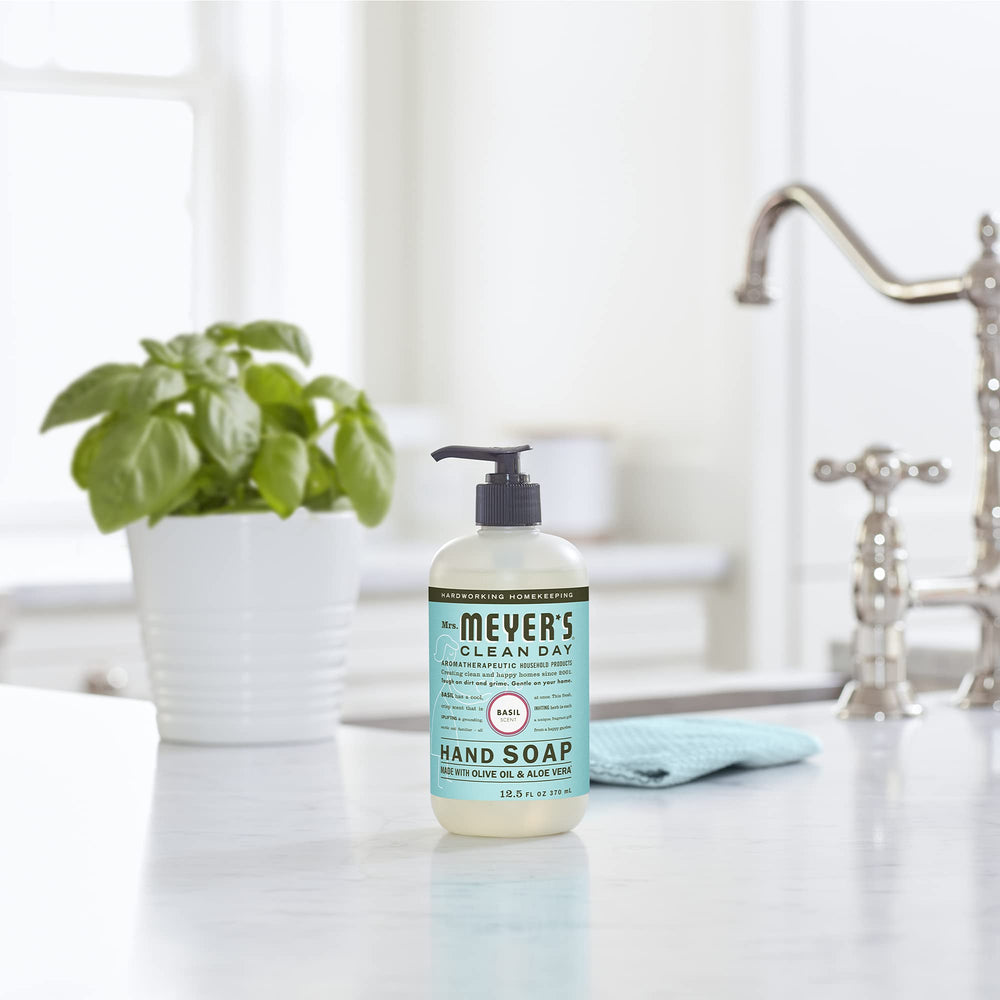 Hands foam with basil soap, enjoying a gentle, refreshing cleanse.