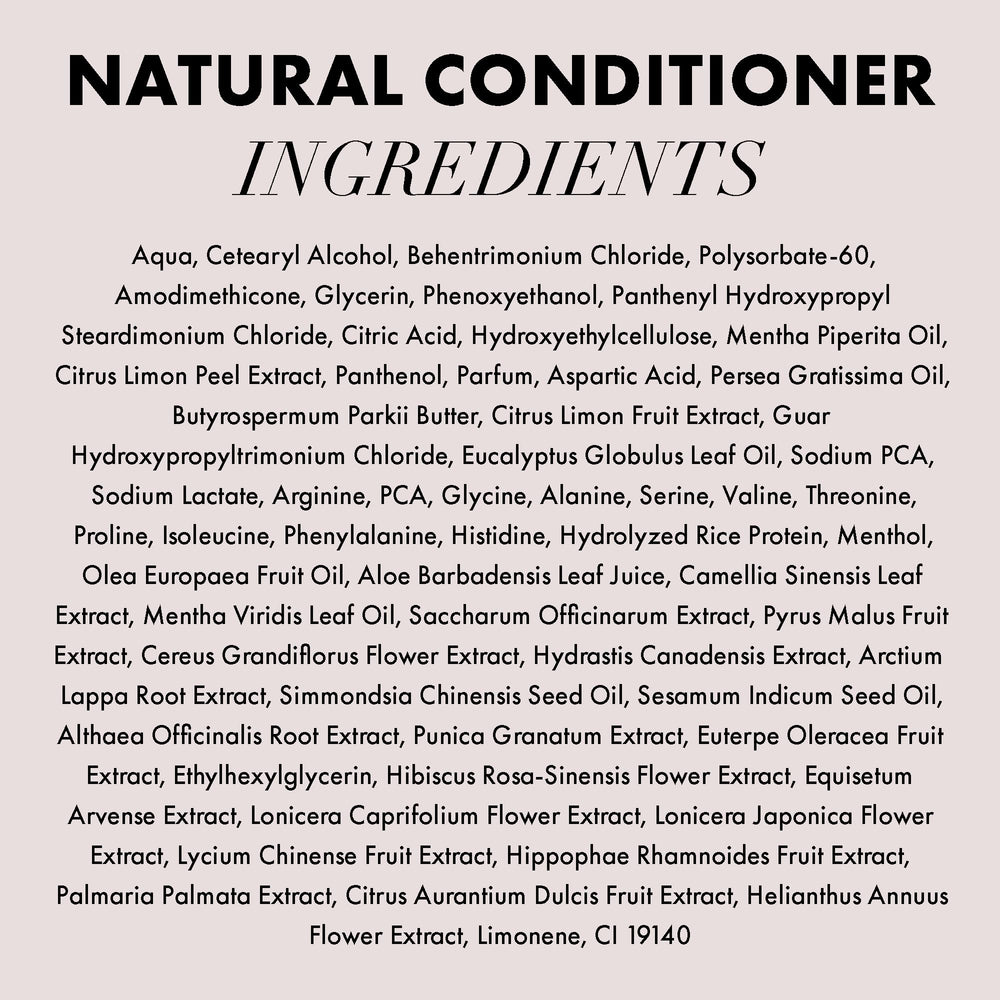 Hands massaging Hanz de Fuko conditioner through hair for even coverage.