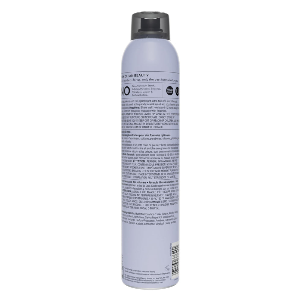 HASK chia seed dry shampoo massaging roots to distribute powder evenly for volume.