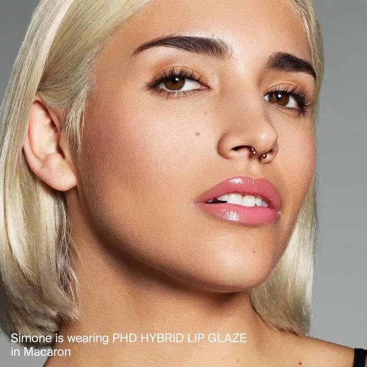 Applying HAUS LABS lip glaze for a smooth glide