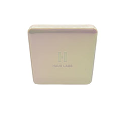 Compact packaging of Haus Laboratories Rose Quartz highlighter for on the go.