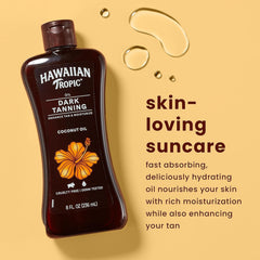 Hawaiian Tropic Dark Tanning Oil applied to skin for a moisturized glow.