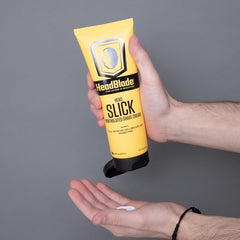 HeadBlade HeadSlick bottle being rinsed to highlight easy rinse formula.