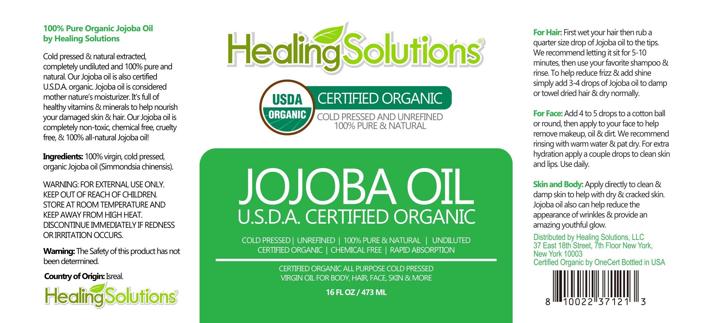 Healing Solutions Jojoba Oil glass bottle closeup showing purity for skin.