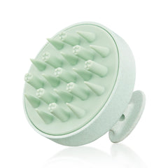 HEETA scalp massager in hand with eco-friendly wheat straw design and soft silicone bristles for gentle cleansing.