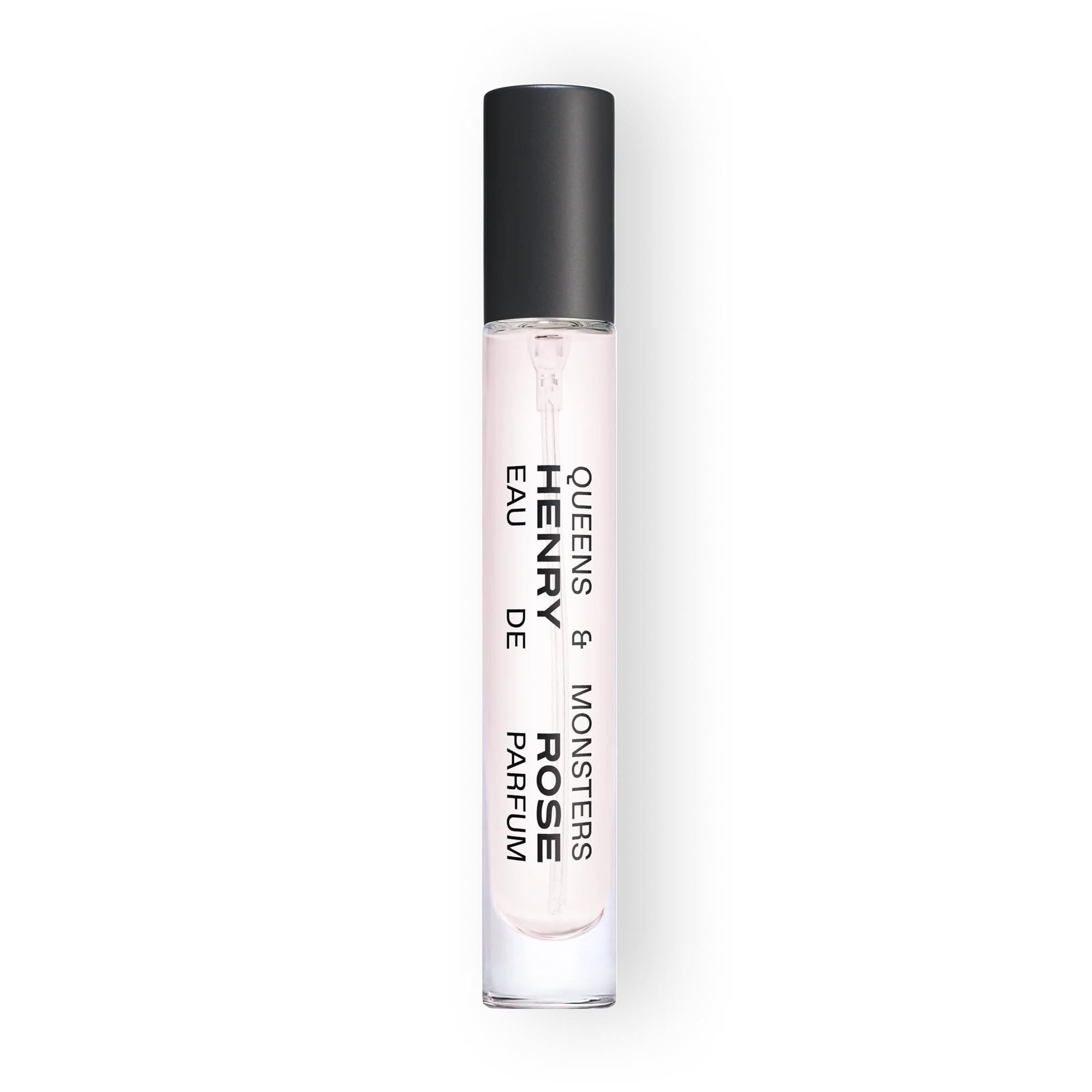 Henry Rose Queens & Monsters travel spray on wrist for on-the-go fragrance touch-ups.