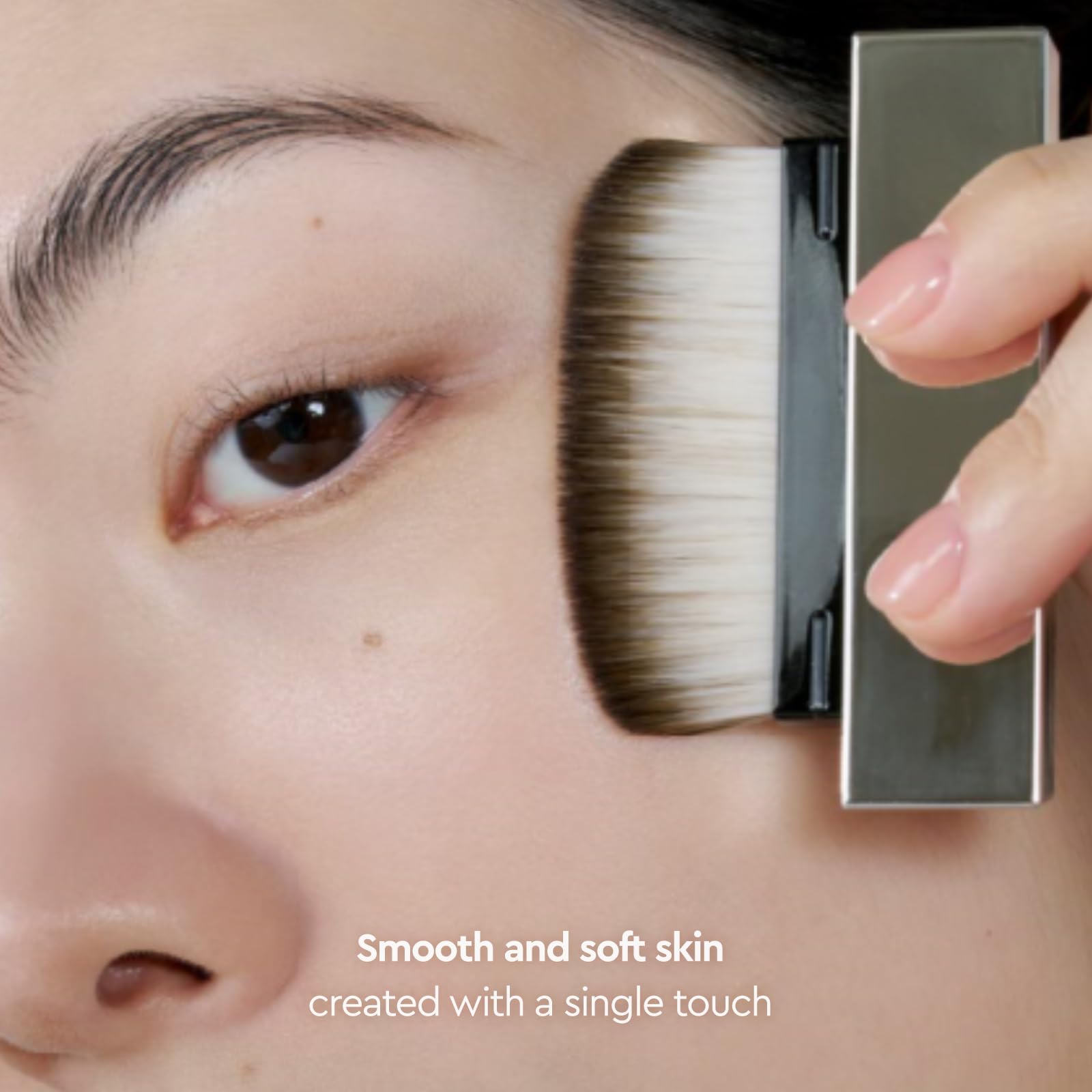 Compact travel-size bottle of HERA primer with included brush