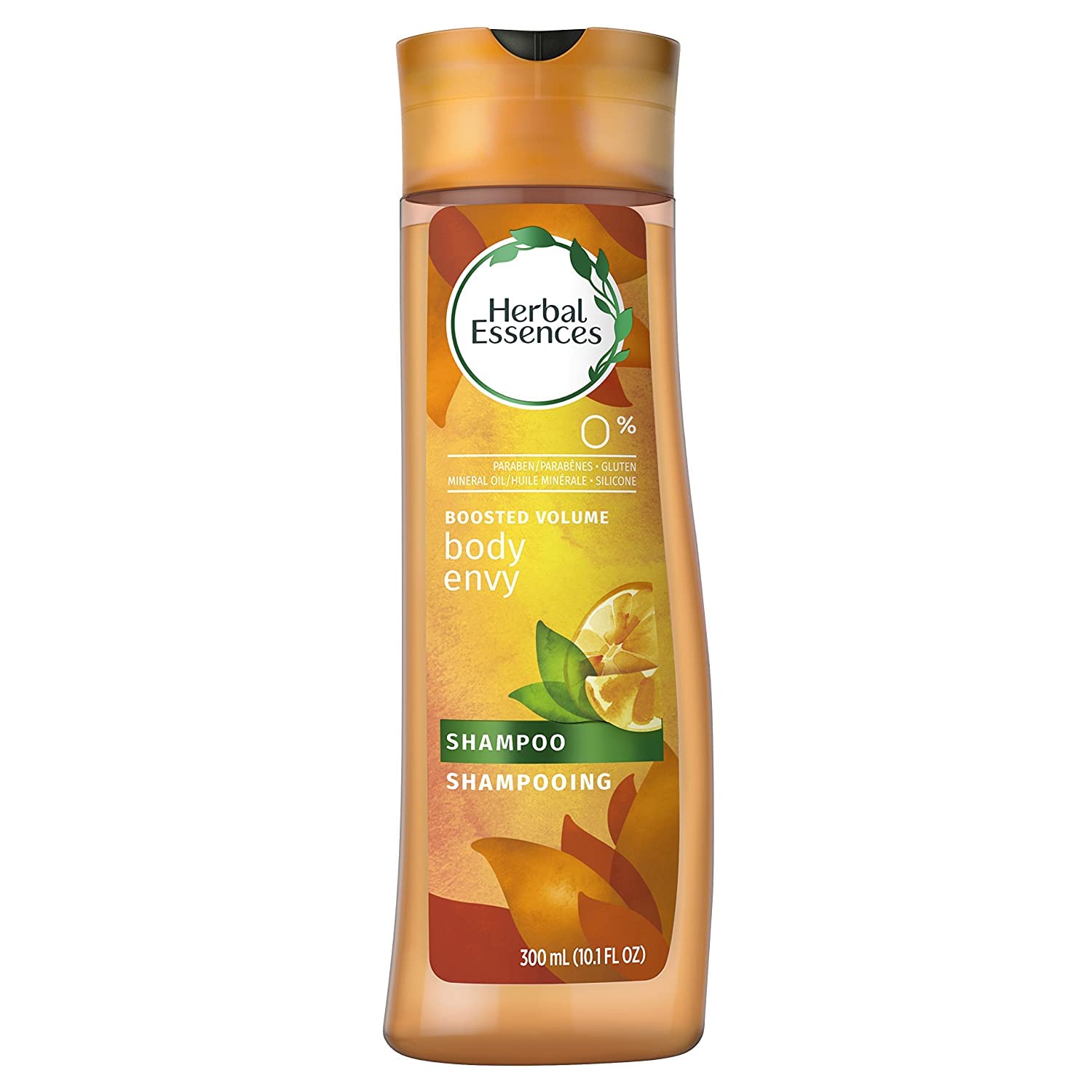 Herbal Essences Body Envy shampoo bottle on dresser reflects premium packaging
