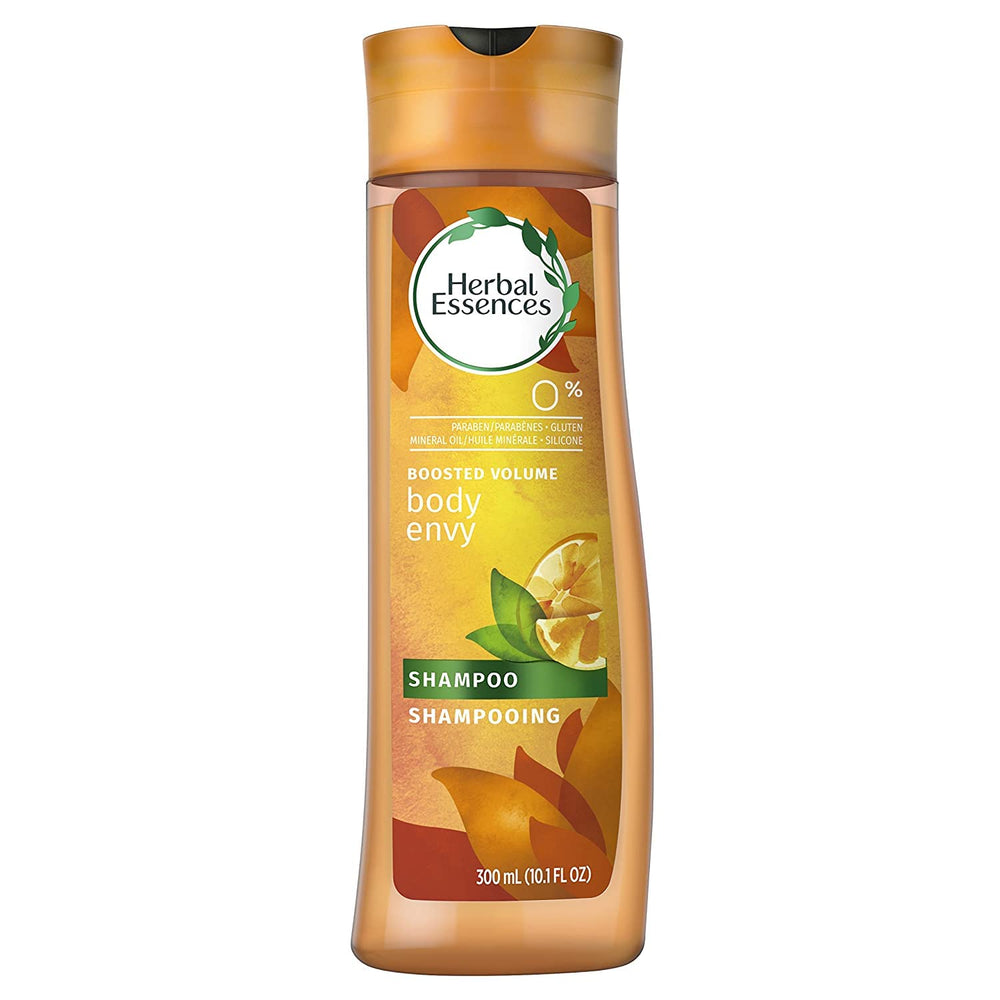 Herbal Essences Body Envy shampoo bottle on dresser reflects premium packaging
