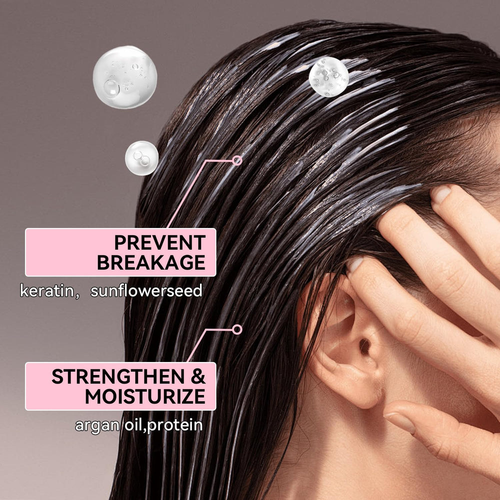 Close-up of Herbalosophy keratin shampoo lather smoothing strands.
