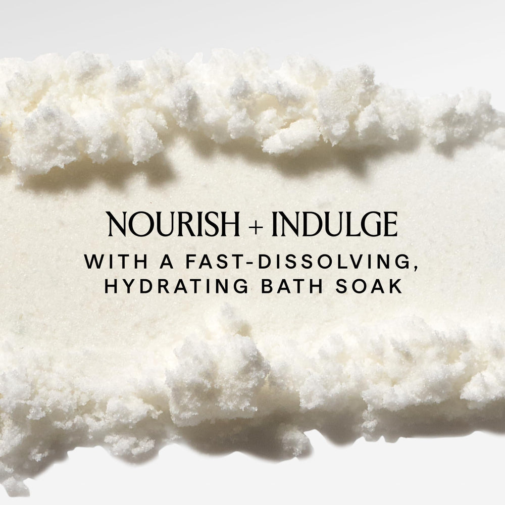 HERBIVORE Coconut Milk Bath Soak creamy texture close-up suggests skin-softening potential.