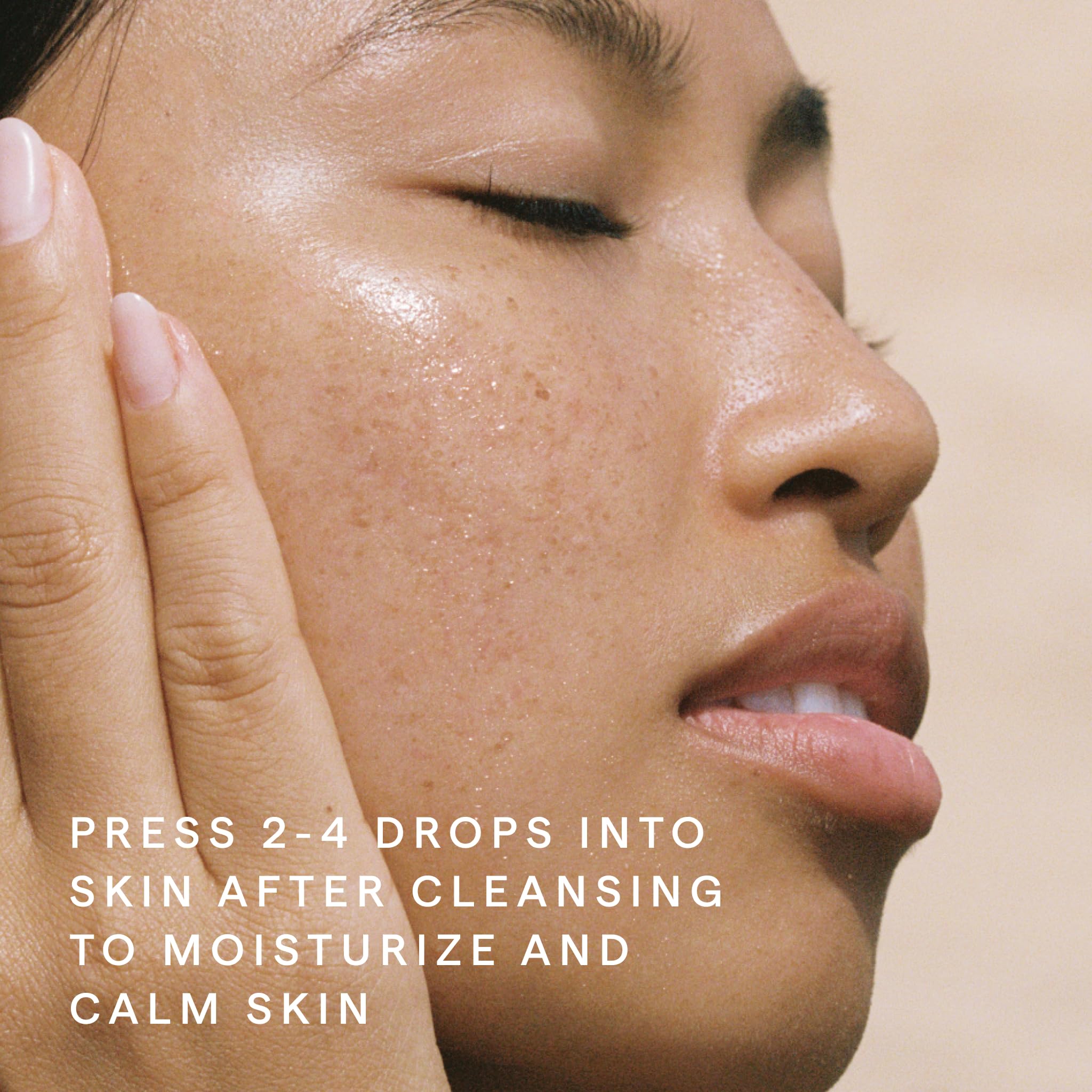 HERBIVORE Emerald Facial Oil hand-application demonstrates daily calm
