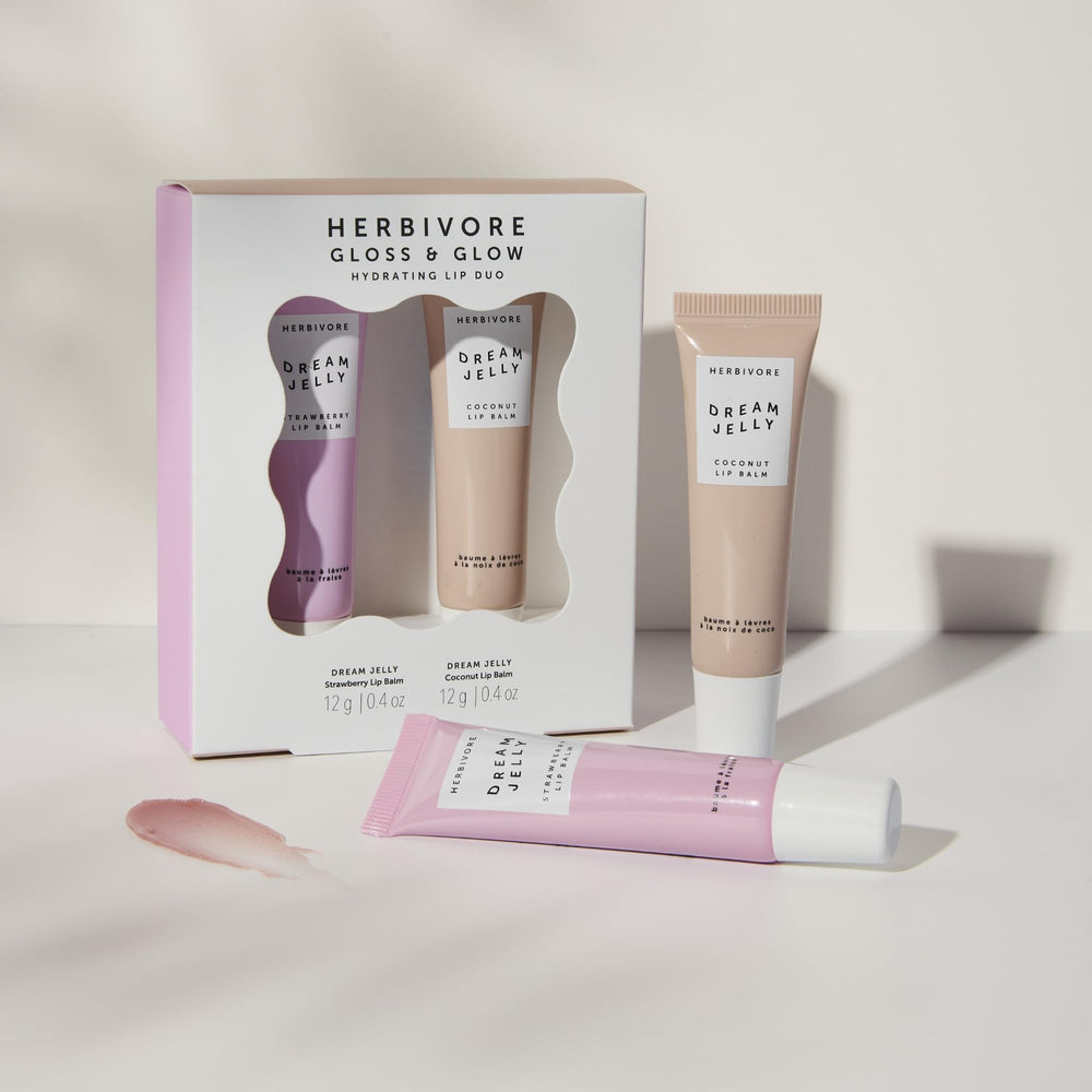 HERBIVORE Gloss and Glow lip duo close-up showcases dual balm sheen.
