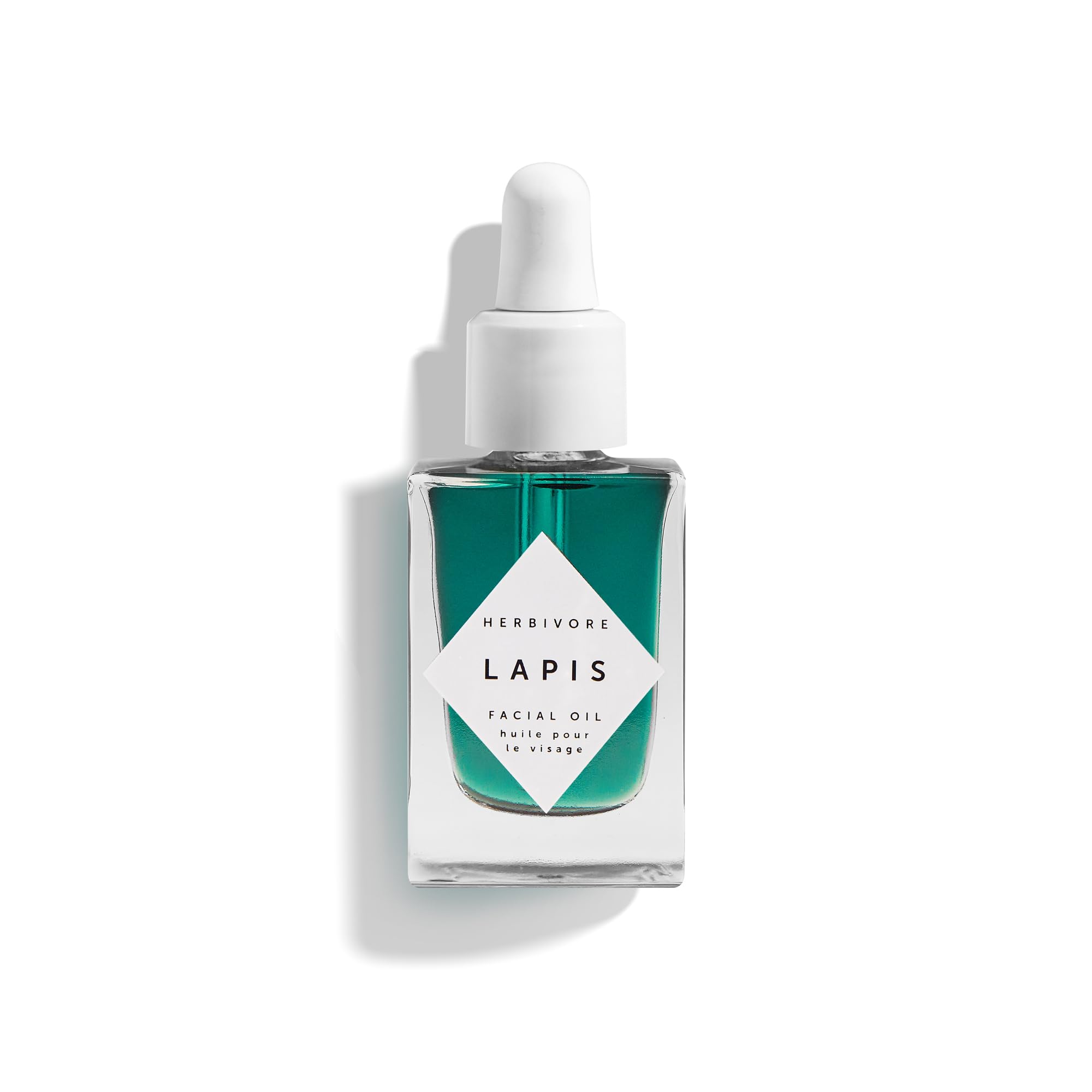 Herbivore Lapis Facial Oil bottle on a clean surface, calming redness and balancing skin.