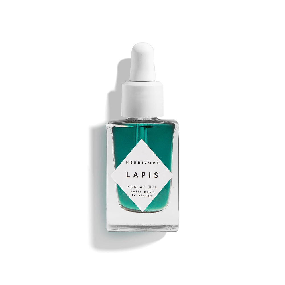 Herbivore Lapis Facial Oil bottle on a clean surface, calming redness and balancing skin.