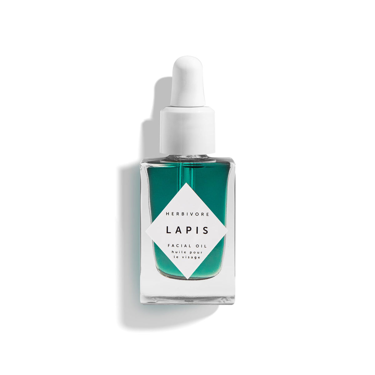 Herbivore Lapis Facial Oil bottle on a clean surface, calming redness and balancing skin.