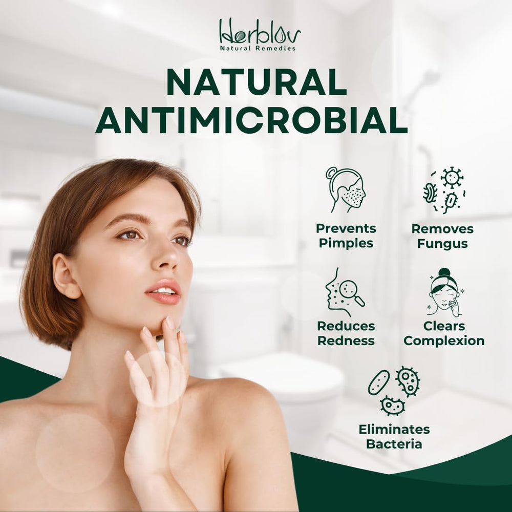 Herblov Tea Tree Oil glistening pour emphasizing natural ingredient benefits.