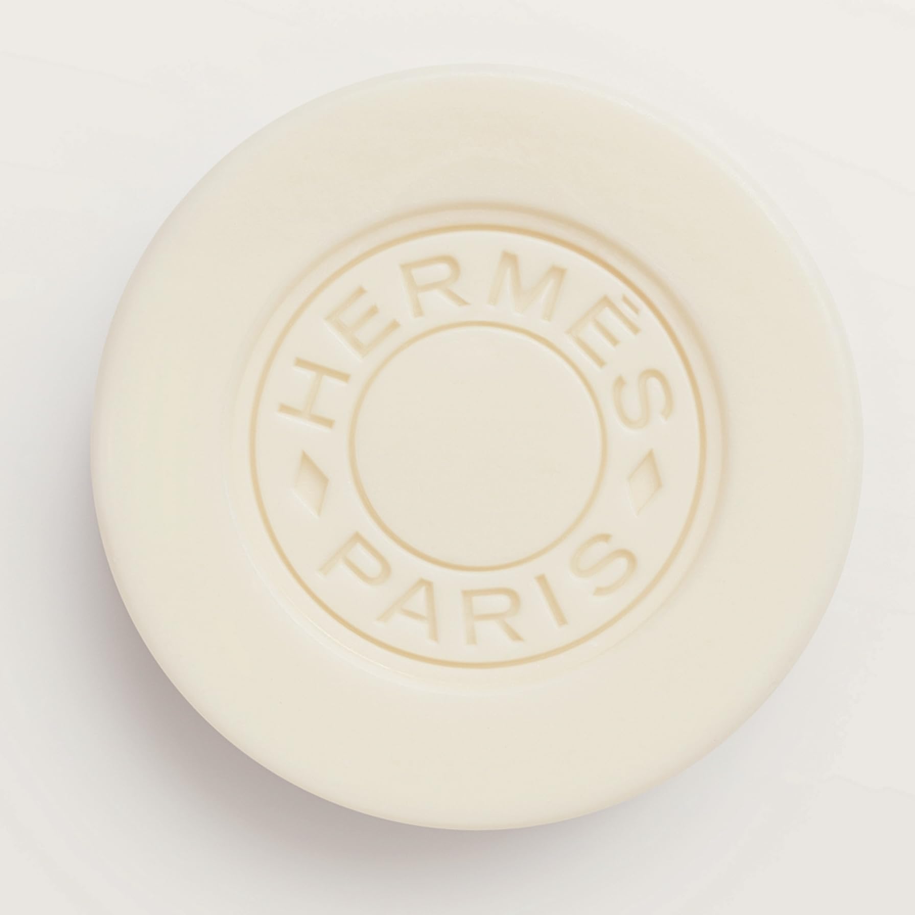 Hermès Twilly swirl-embossed detail image highlighting elegant design