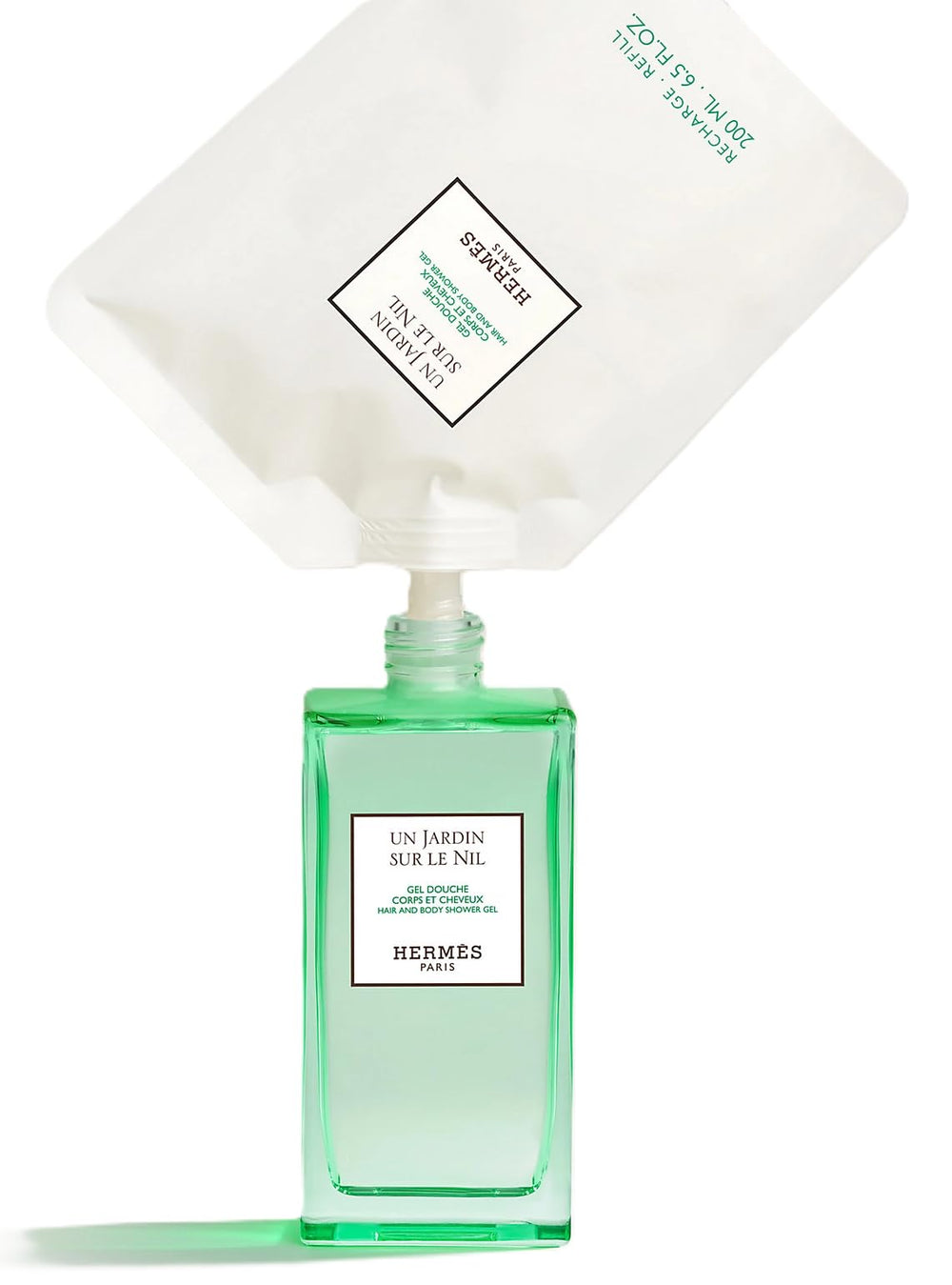 Bottle cap and label showcase Hermès Un Jardin Sur Le Nil, ideal for daily ritual.