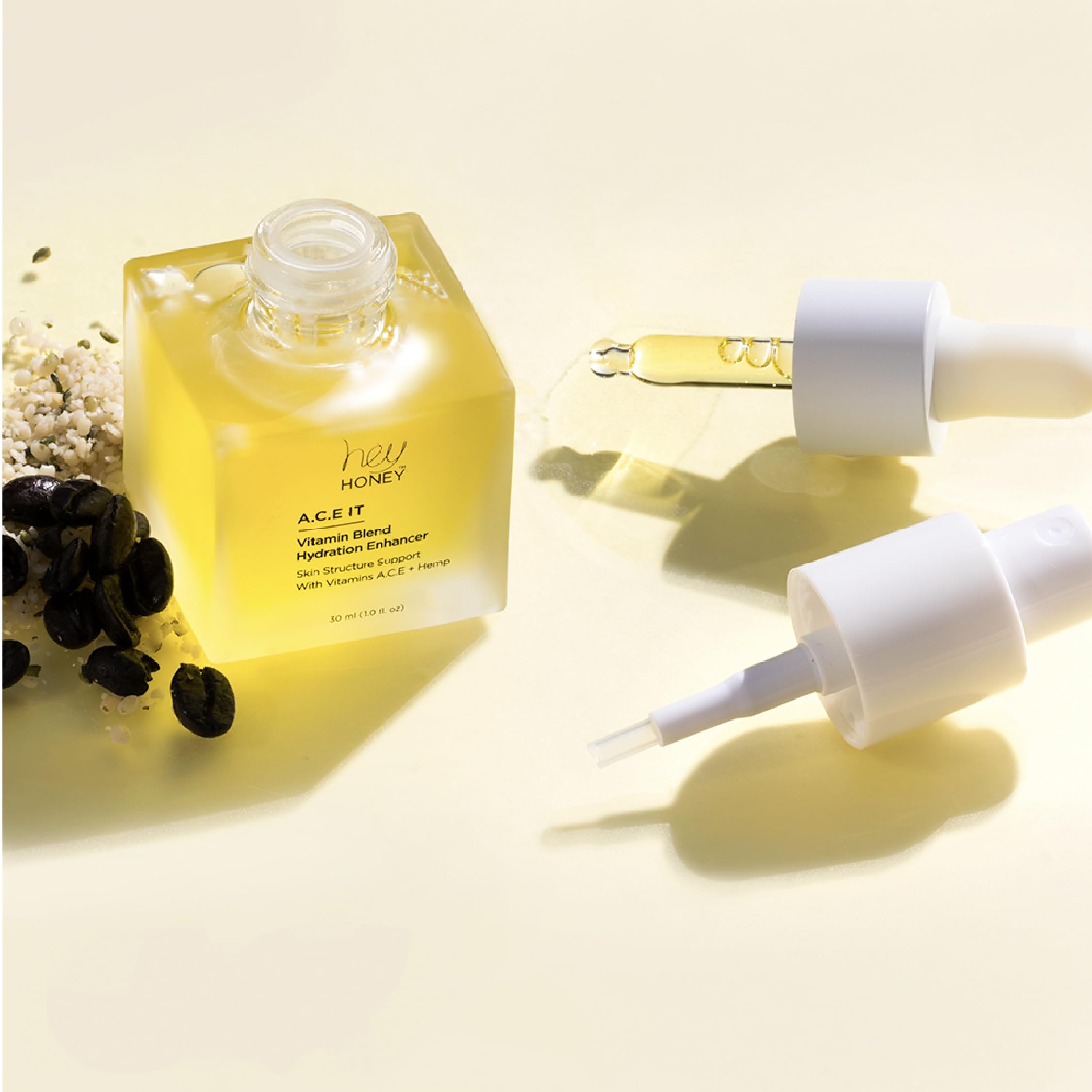 Hey Honey glow-boosting serum applied smoothly beneath makeup for lasting luminosity.