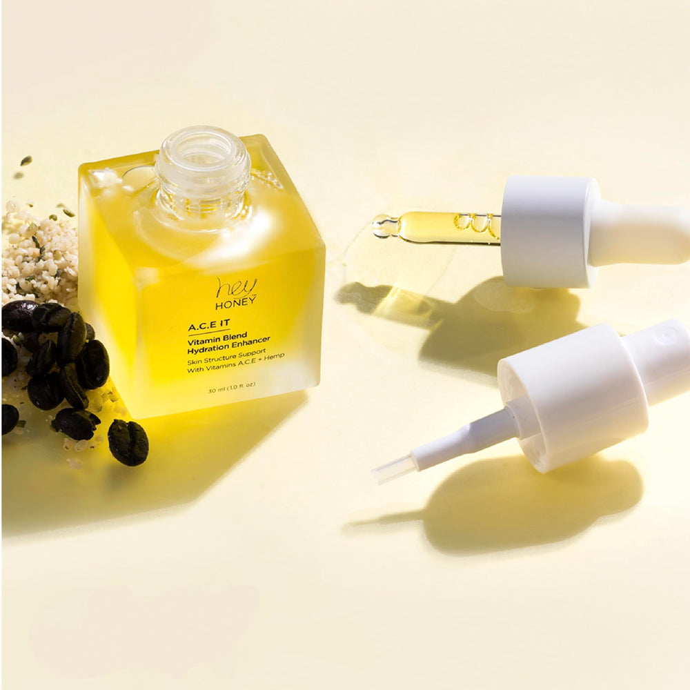 Hey Honey glow-boosting serum applied smoothly beneath makeup for lasting luminosity.