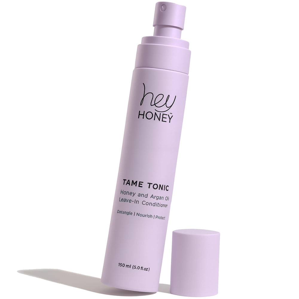 Hey Honey Tame Tonic honey-argan leave-in spray for silky, frizz-free results.