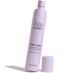 Hey Honey Tame Tonic honey-argan leave-in spray for silky, frizz-free results.