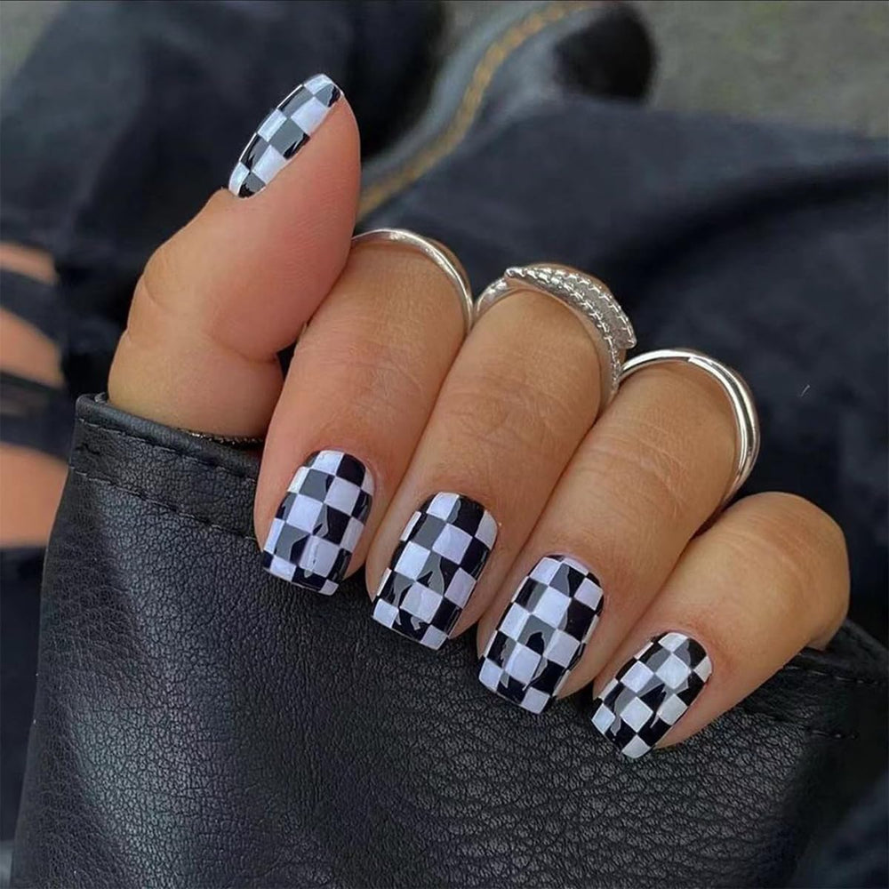 HJKDSFD checkerboard press-on nails in black and white for a quick salon look.