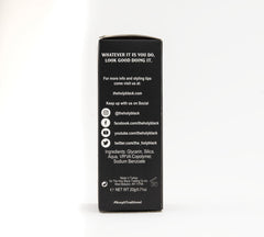 HOLY BLACK powder being applied to hair roots for lift