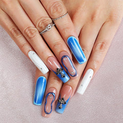 Homsera blue 3D cross and circle decor nails close-up for chic accents