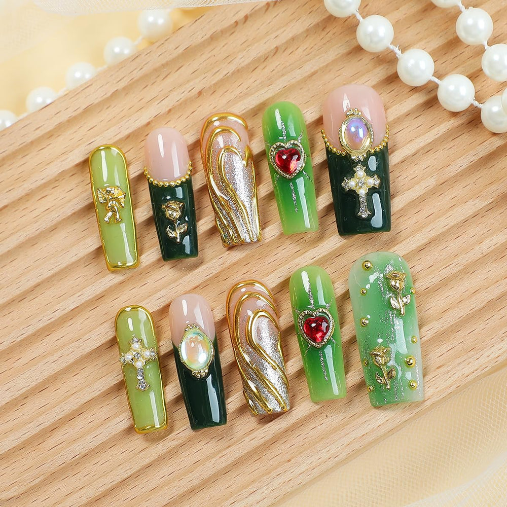 Homsera cross design nails with gold accents for special occasions.