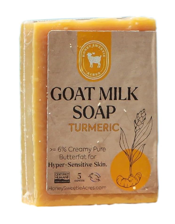 Honey Sweetie Acres turmeric goat milk soap bar closeup showing creamy lather and luxurious texture.
