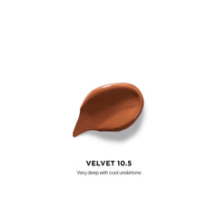 Hourglass Vanish Airbrush Concealer applicator close-up for precise application.