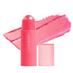 Huda Beauty Cheeky Tint Blush Stick Proud Pink swatch for dewy, buildable flush