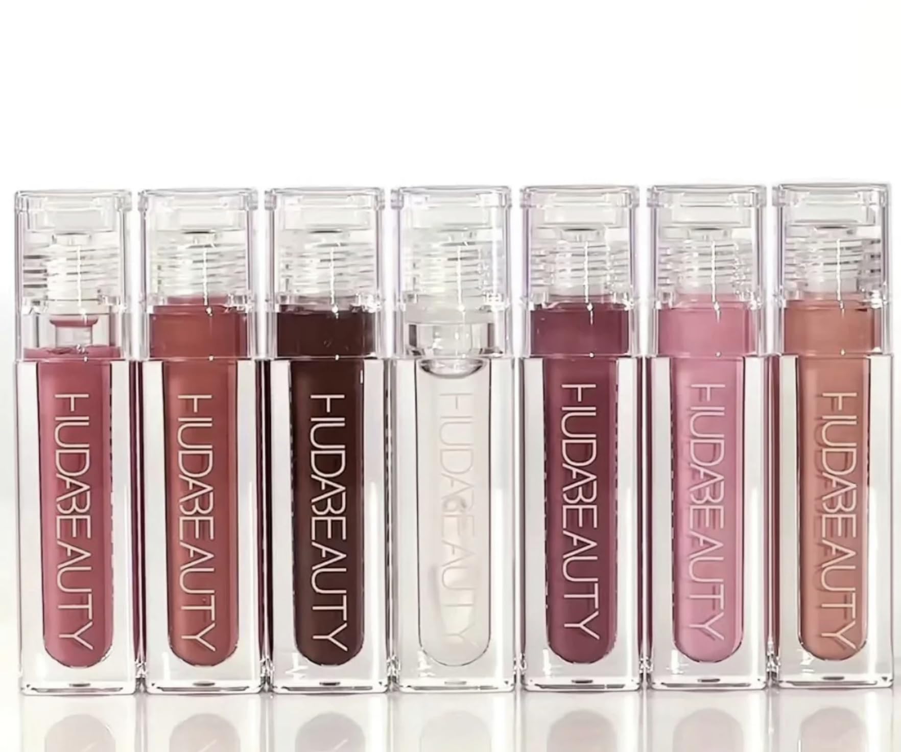 Wand application shot demonstrates smooth glide and non-sticky wear for daily lip gloss rituals.