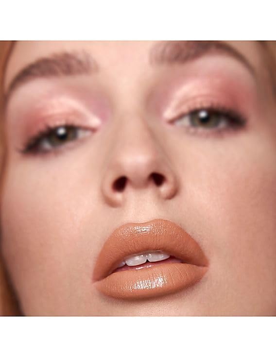 HUDA Beauty Power Bullet Cream Glow Rajah glow on lips highlights creamy finish.