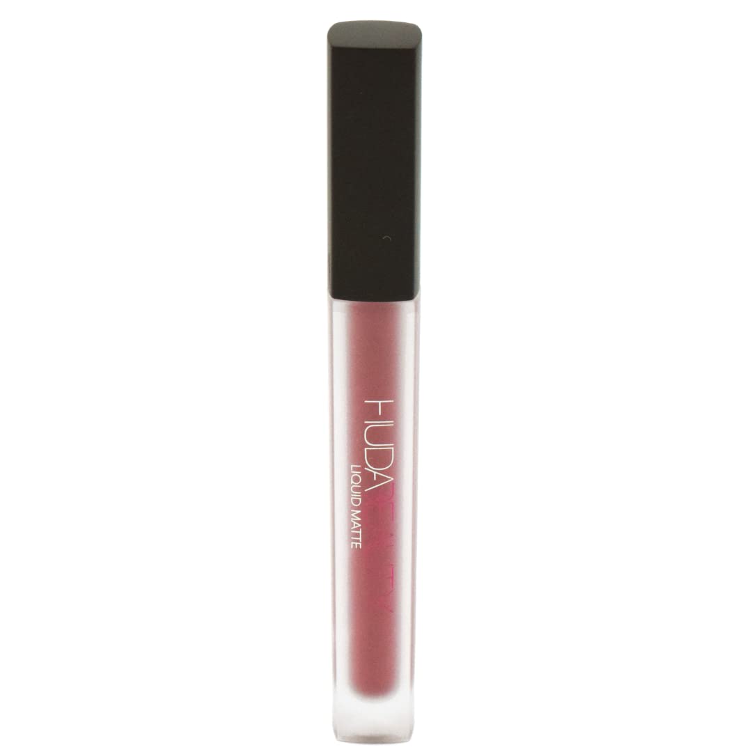 Huda Muse Liquid Matte Lipstick front view showing creamy muted rose for everyday wear.