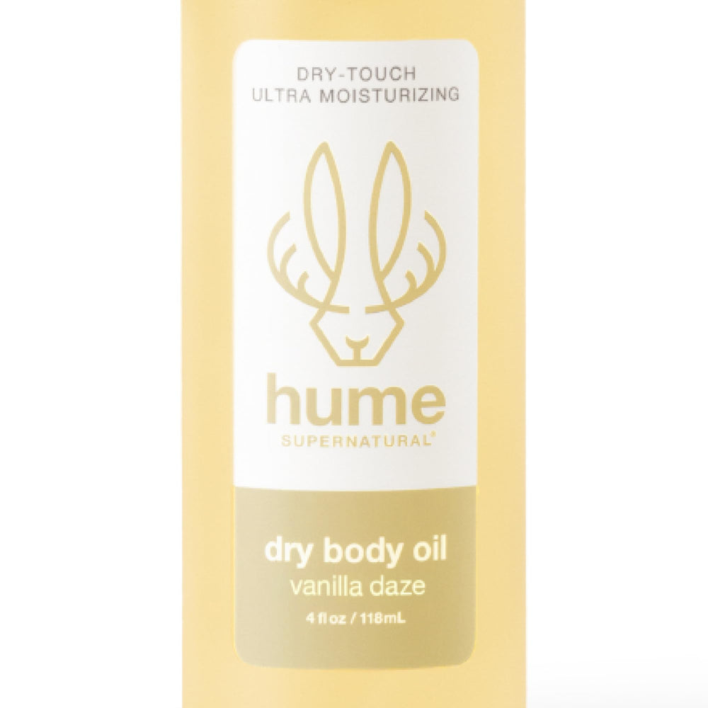 HUME SUPERNATURAL Dry Body Oil Spray Vanilla Daze bottle for radiant skin hydration.