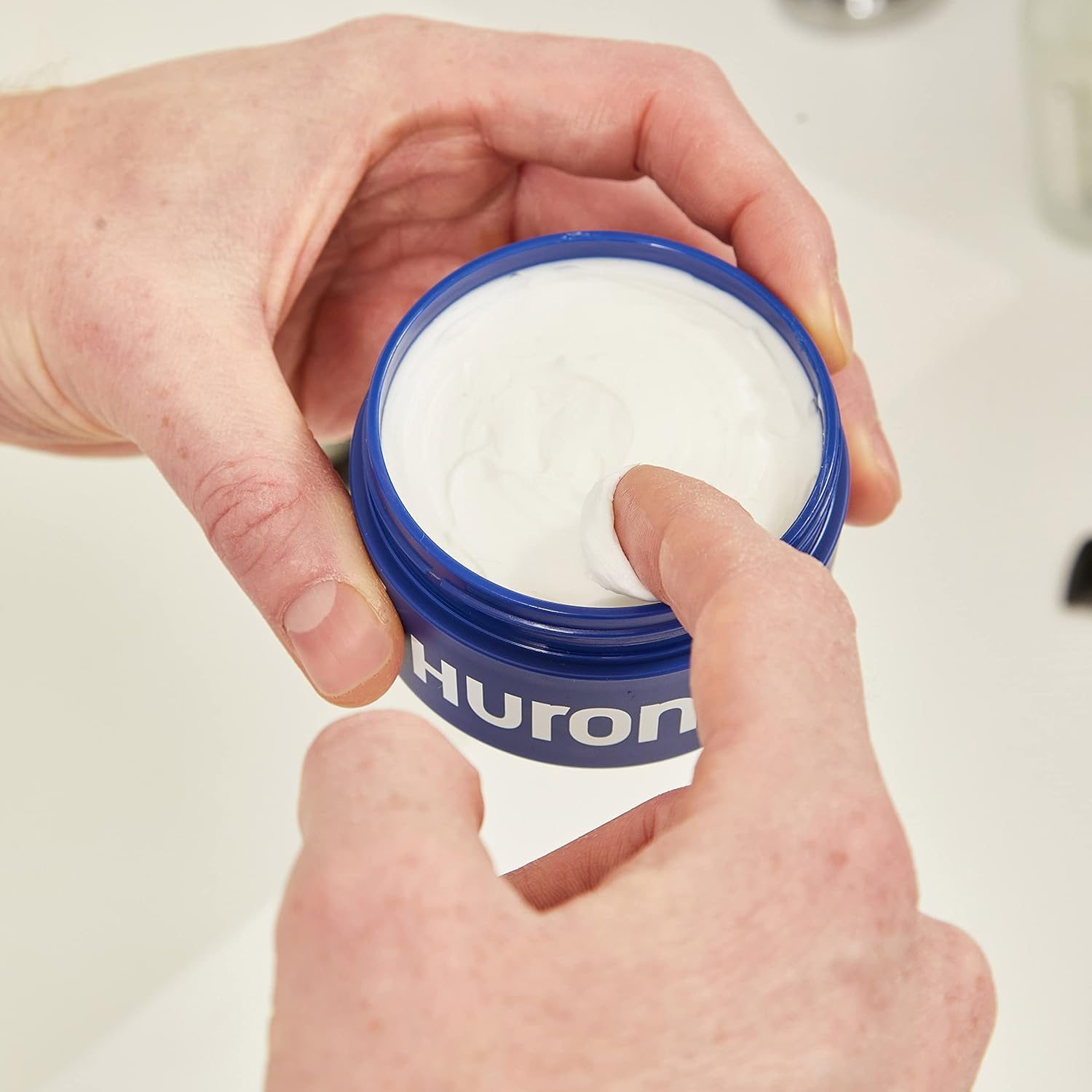 Huron Clean Citrus Woods hair styler in use shows natural matte finish.