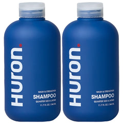 Huron Clean Citrus Woods shampoo bottle, 12 oz, sleek design for daily use.
