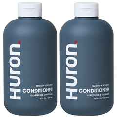 Huron Men’s Conditioner bottle front highlights lightweight hydration for frizz control.