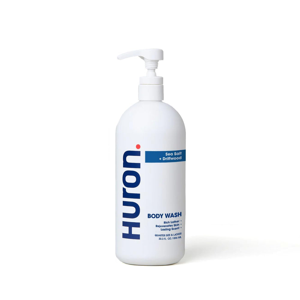 Huron Men's Moisturizing Body Wash bottle with coconut oil for a hydrating cleanse.