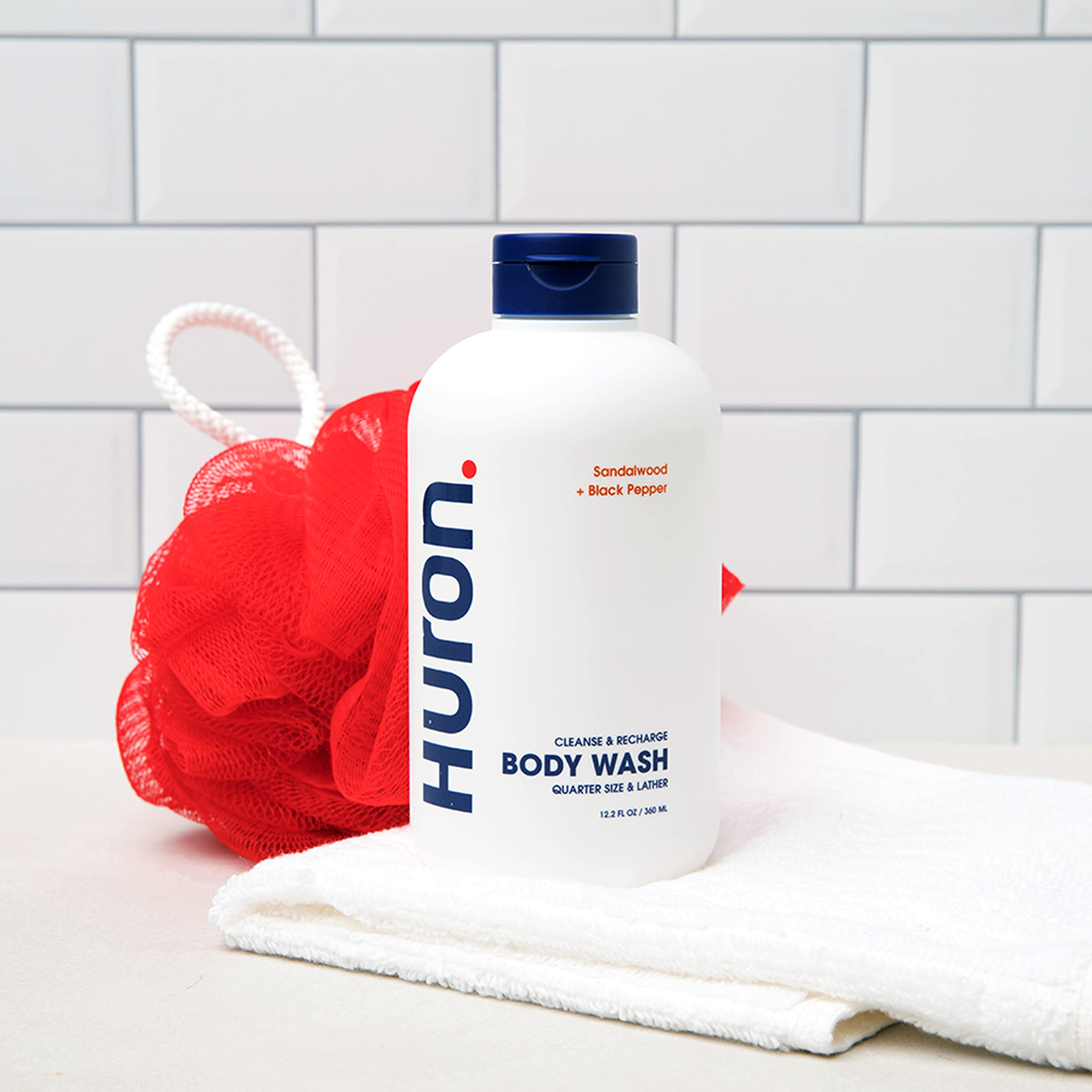 Huron bottle pour shot showing easy dispensing for quick showers