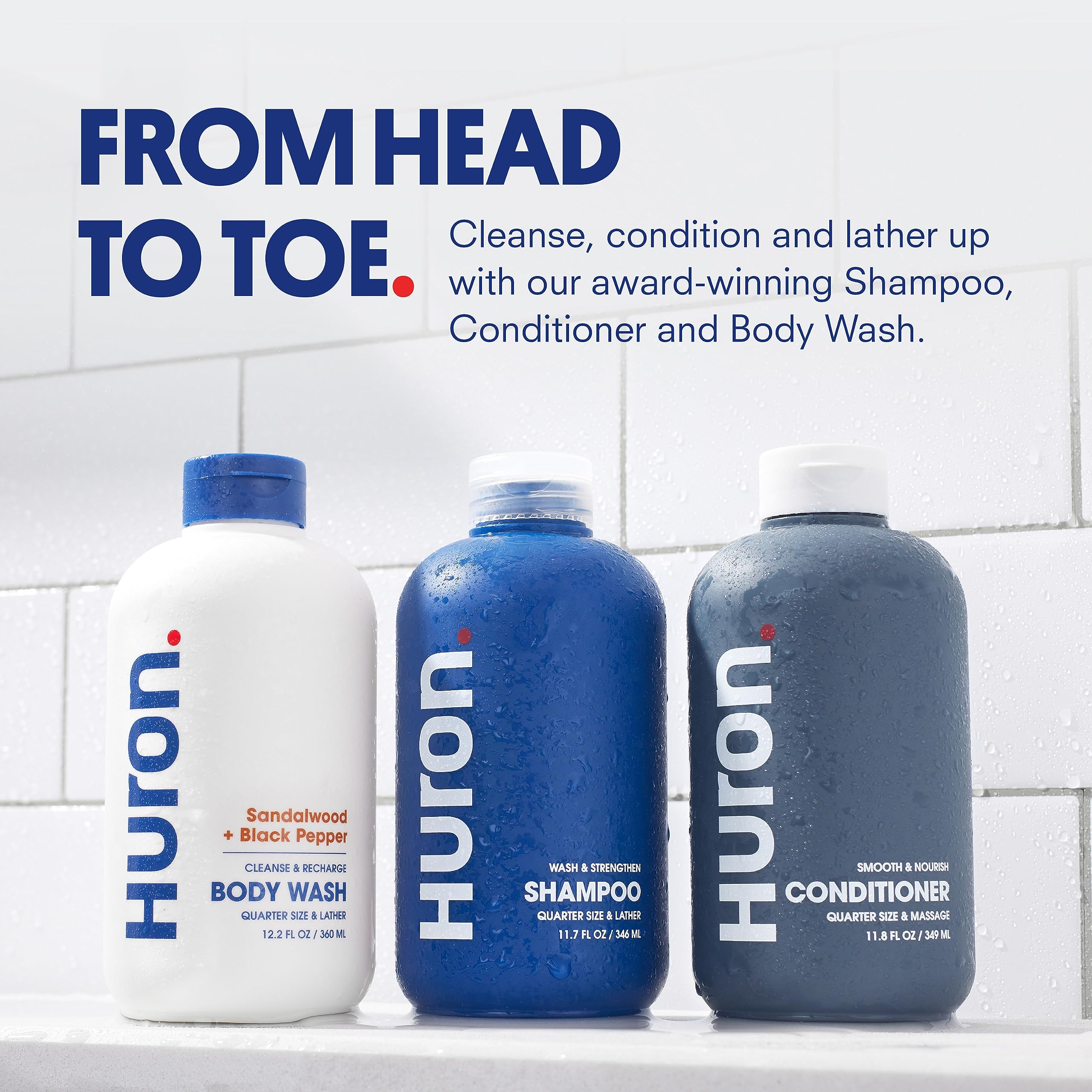 Huron Shower Kit conditioner bottle nourishes dry hair for smooth, manageable strands.