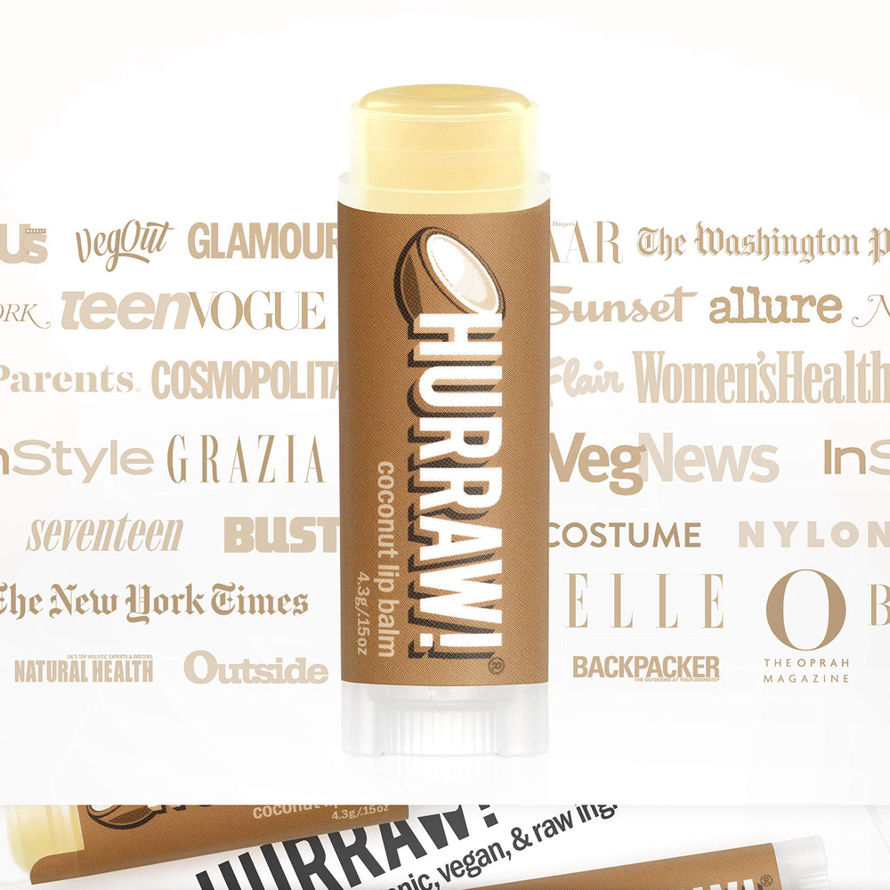 Hands using Hurraw! Coconut Lip Balm for on-the-go moisture