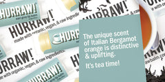 HURRAW Earl Grey lip balm tube open, creamy texture ready for application