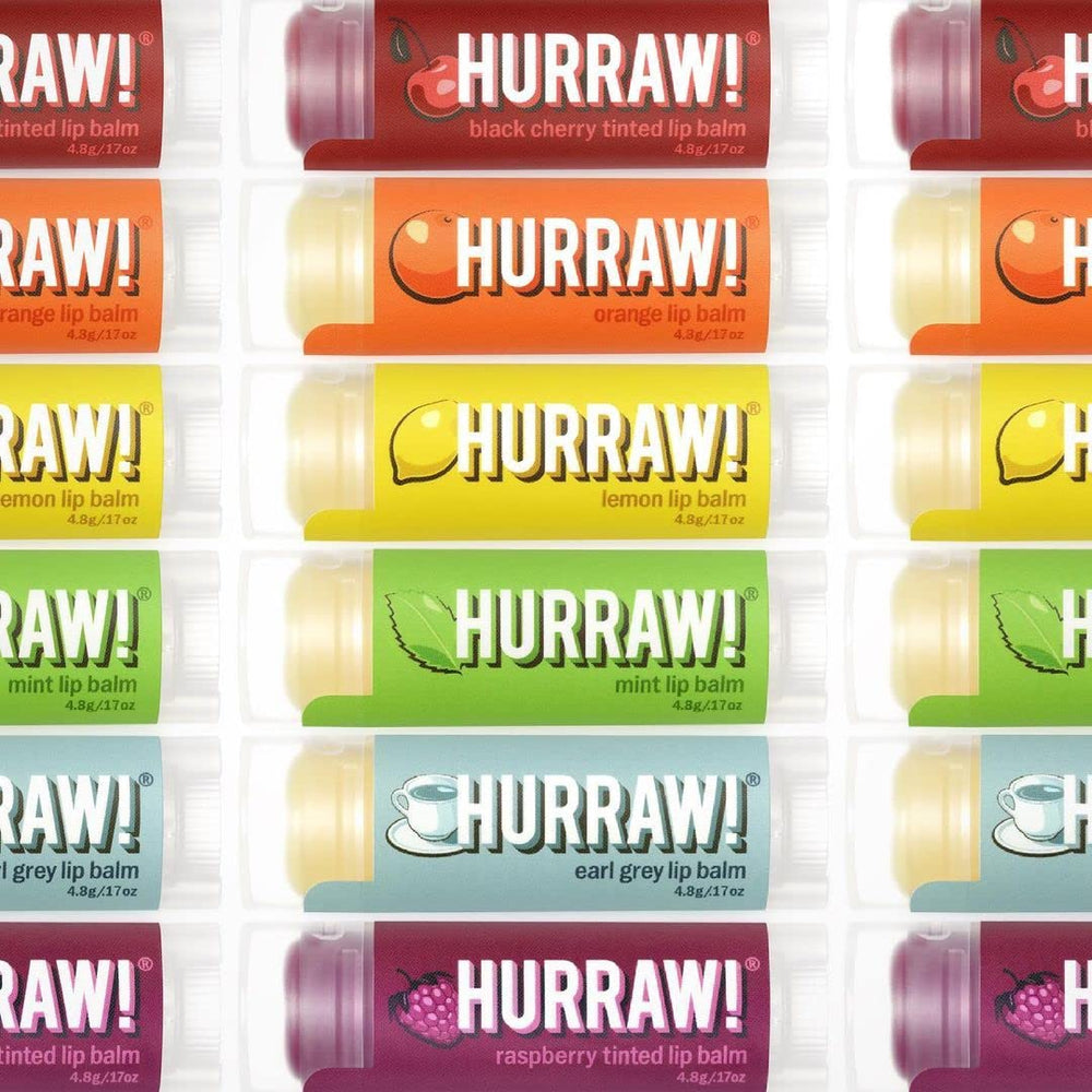 Hurraw! Orange lip balm with bright citrus scent and lightweight moisture.