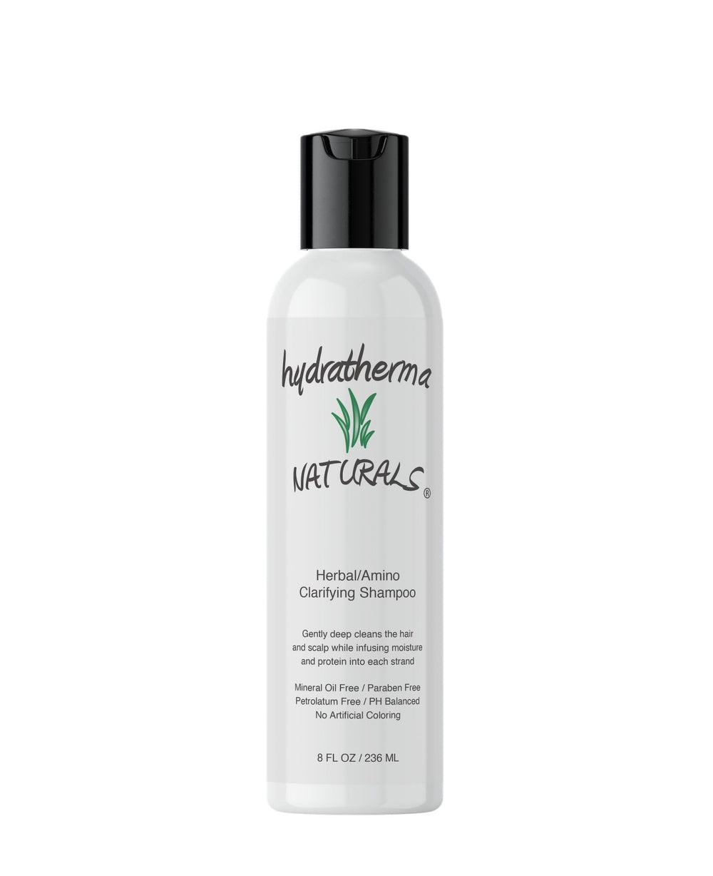 Hydratherma Naturals Herbal Amino Clarifying Shampoo bottle pouring, refreshing cleanse that respects natural oils.